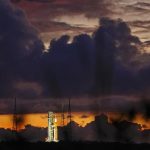The NASA moon rocket stands ready at sunrise on Pad 39B before the Artemis 1 mission to orbit the moon at the Kennedy Space Center, Monday, Aug. 29, 2022, in Cape Canaveral, Fla. (AP Photo/Brynn Anderson)