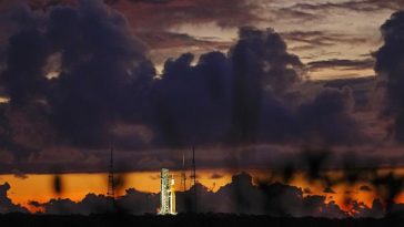 The NASA moon rocket stands ready at sunrise on Pad 39B before the Artemis 1 mission to orbit the moon at the Kennedy Space Center, Monday, Aug. 29, 2022, in Cape Canaveral, Fla. (AP Photo/Brynn Anderson)